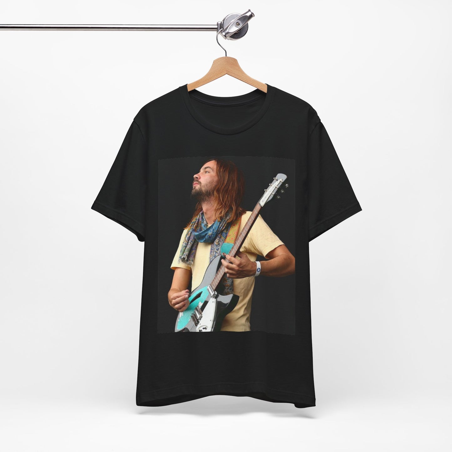 A black graphic t-shirt featuring a vintage indie rock graphic of Tame Impala.