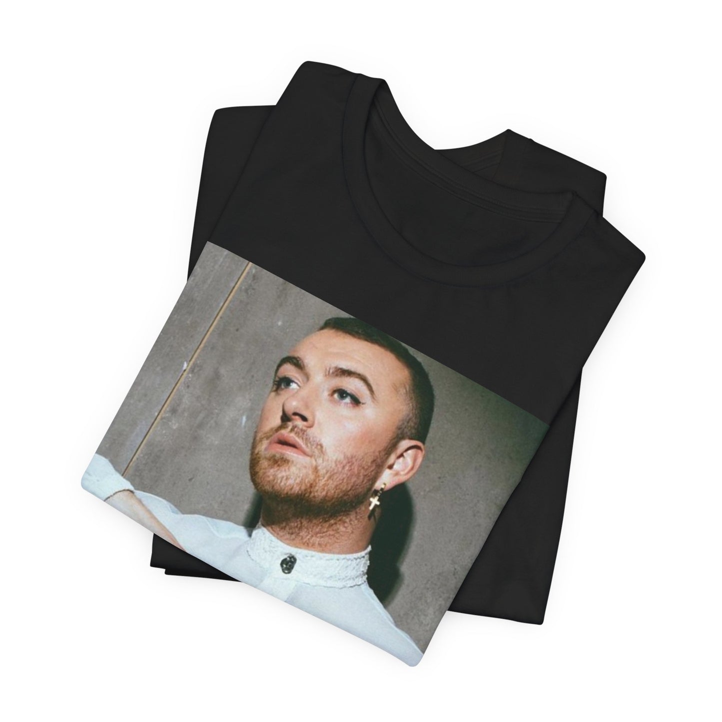 A black graphic t-shirt featuring a vintage graphic of Sam Smith emphasizing their soulful voice.