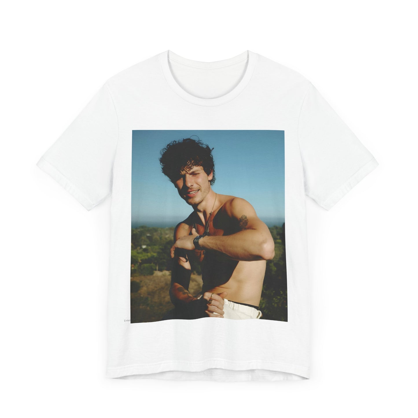 A black graphic t-shirt featuring a graphic of Shawn Mendes with a chill pop star look.
