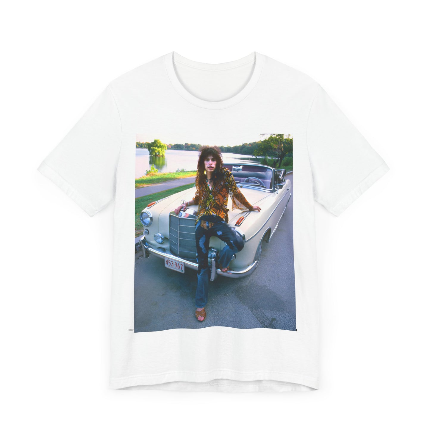 A black graphic t-shirt featuring a retro 70s photo of Aerosmith band members in a bohemian style, posing with a classic Mercedes car.