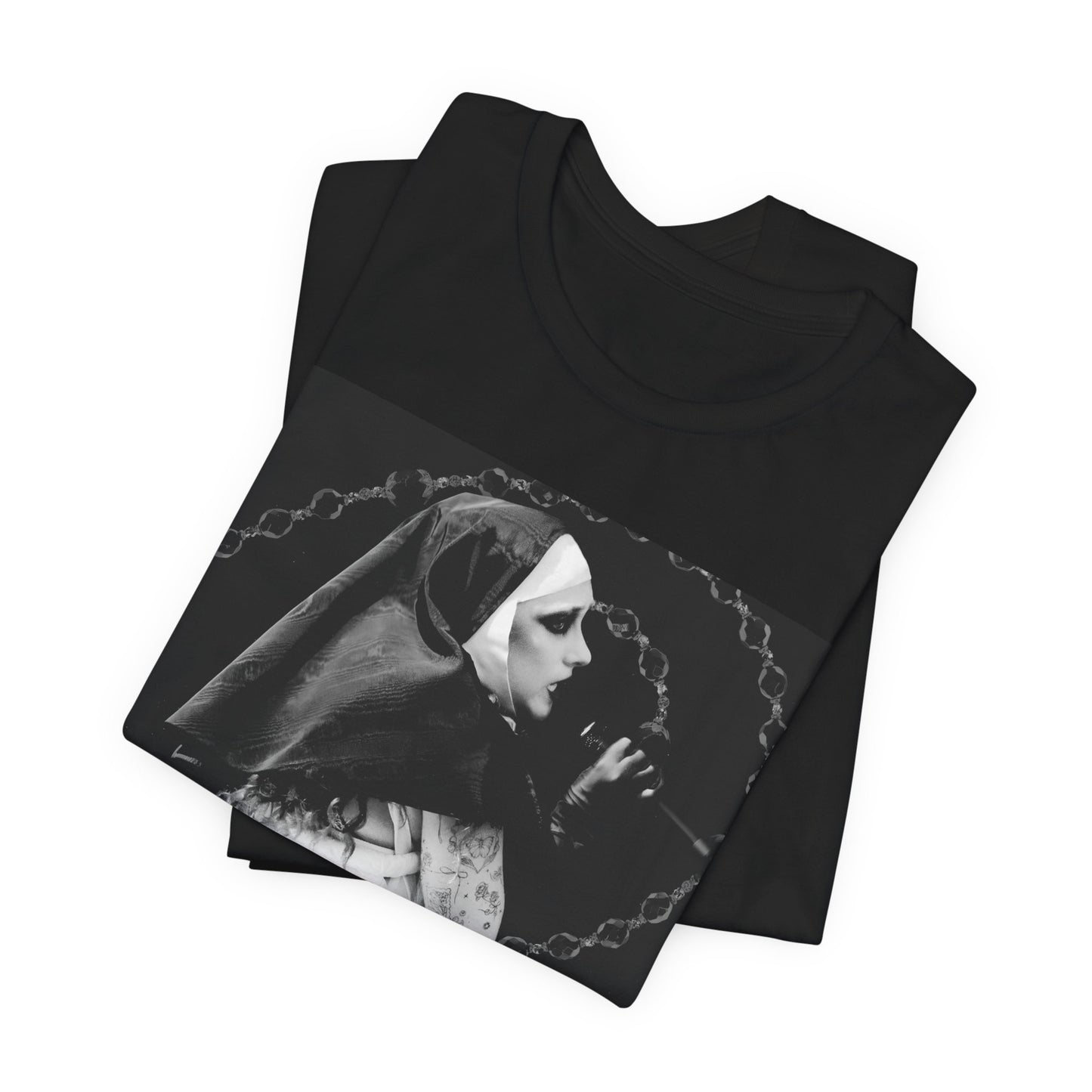 A black graphic t-shirt featuring a retro glam-style graphic of Chappell Roan dressed as a nun.