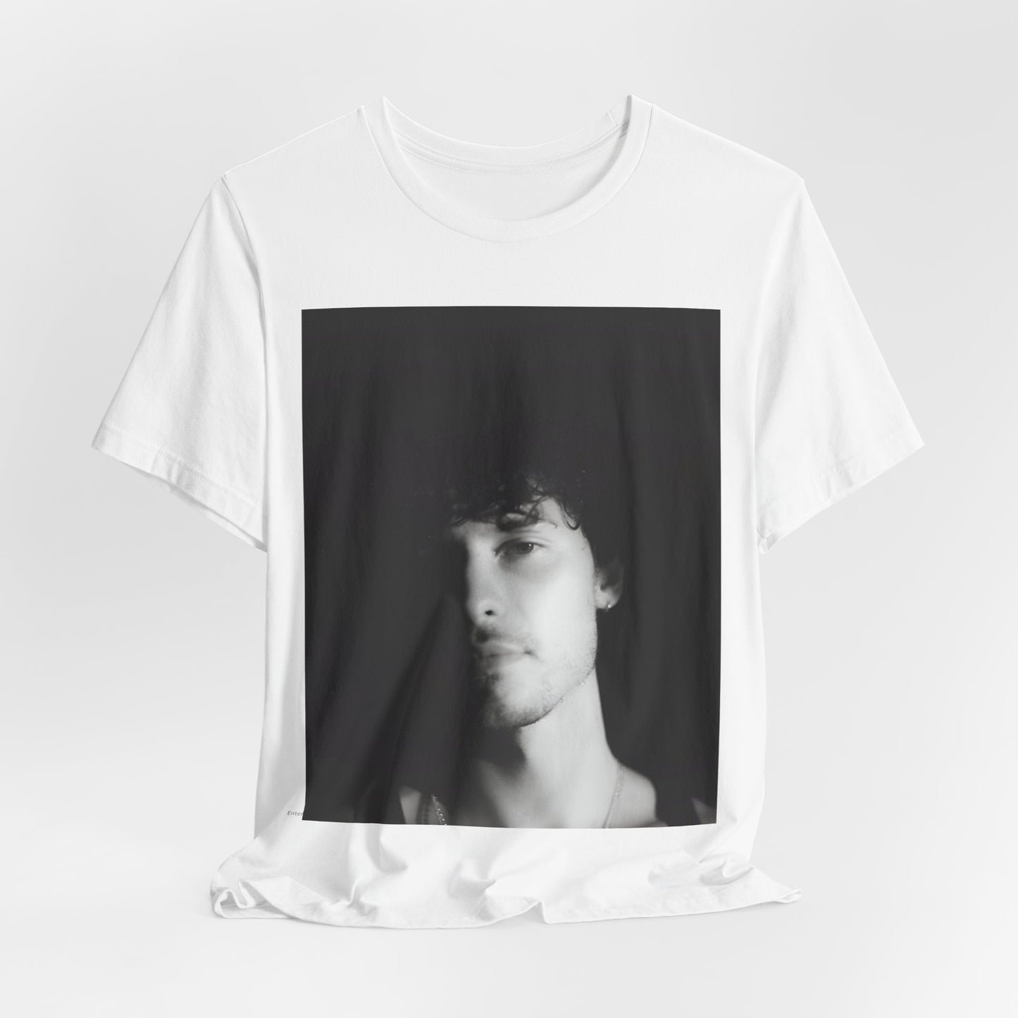 A black graphic t-shirt featuring a black and white portrait photo of Shawn Mendes.