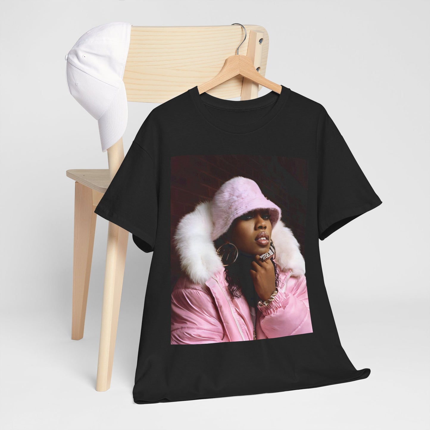 A black graphic t-shirt featuring a graphic of Missy Elliott as an underground hip hop queen.