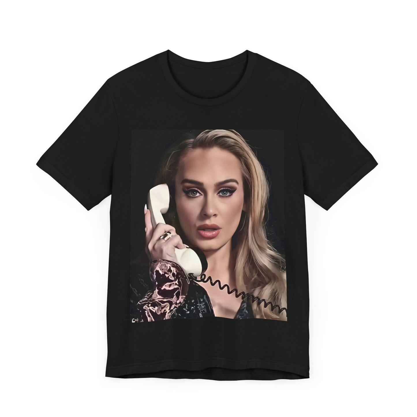 A black graphic t-shirt featuring a black and white candid photo of Adele with a phone to her ear, showing a thoughtful or emotional expression.