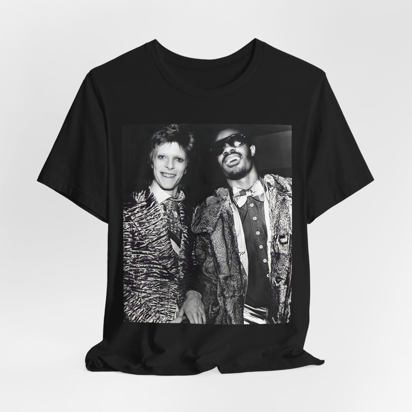 A black graphic t-shirt featuring a retro graphic of Stevie Wonder and David Bowie together.