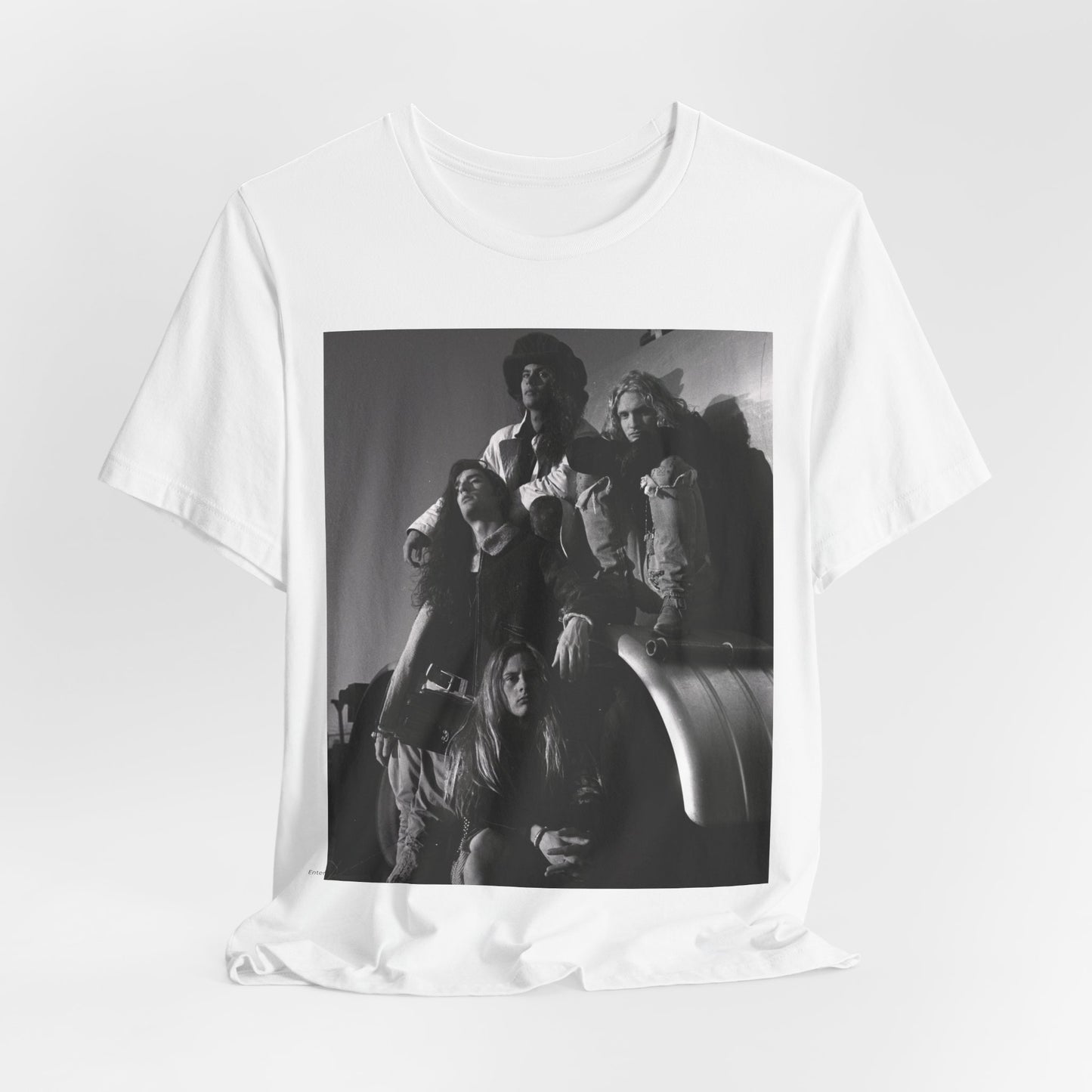 A black graphic t-shirt featuring a 90s black and white photographic portrait of the band Alice In Chains, capturing their iconic grunge look.