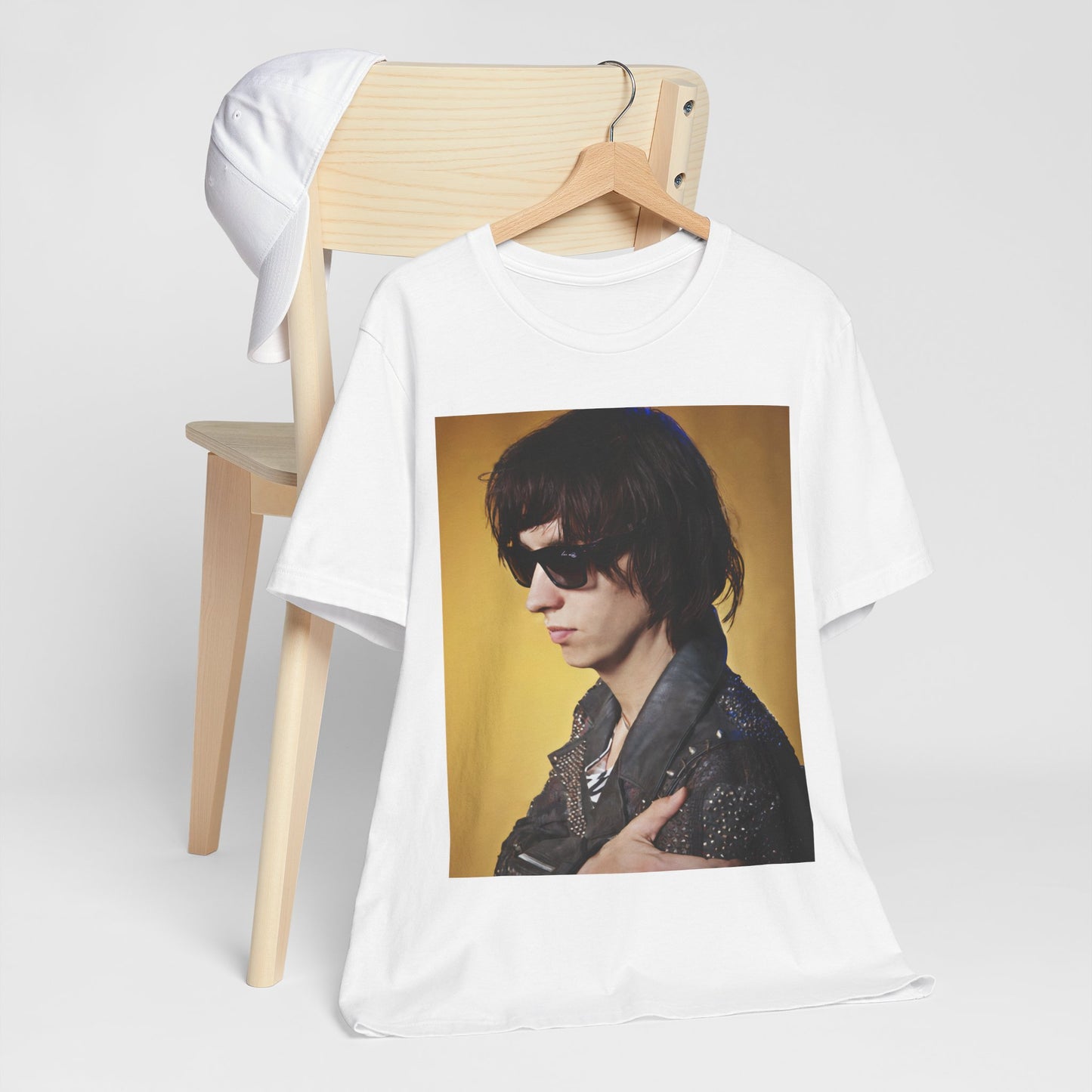 A black graphic t-shirt featuring a retro graphic related to The Strokes' 'Is This It' album era.