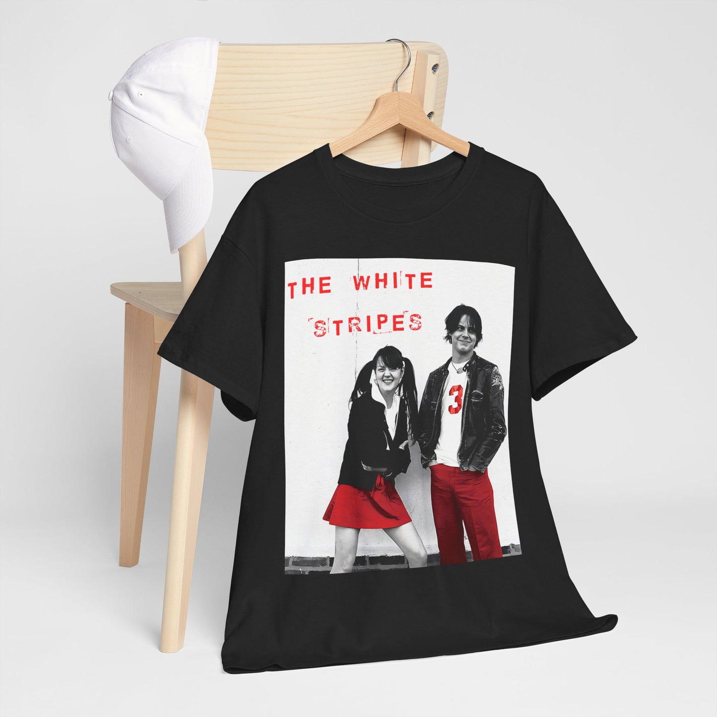 A black graphic t-shirt featuring a fearless attitude graphic of The White Stripes.