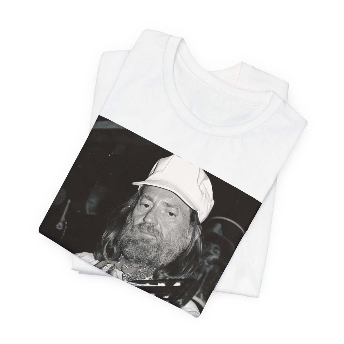 A black graphic t-shirt featuring a 70s cool free spirit graphic of Willie Nelson.