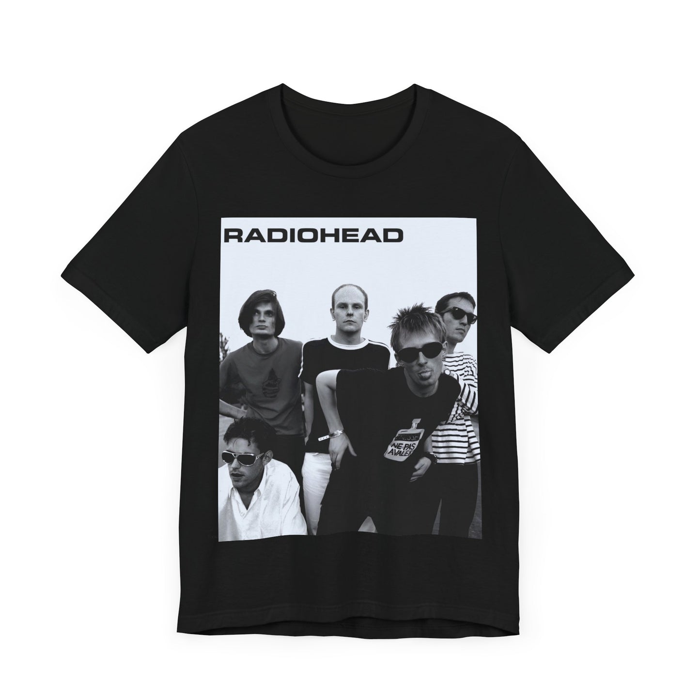 A black graphic t-shirt featuring a vintage 90s graphic related to Radiohead's 'Creep' song or era.