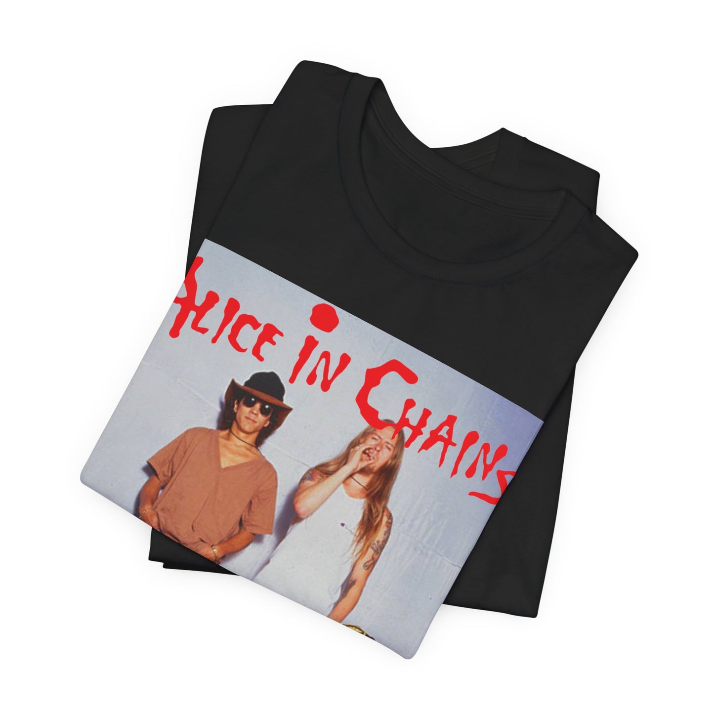 A black graphic t-shirt featuring a band graphic of Alice In Chains from 1990, capturing their early grunge aesthetic.