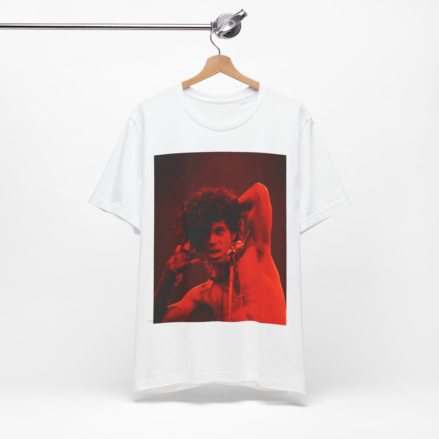 A black graphic t-shirt featuring a concert pop fan graphic of Prince.