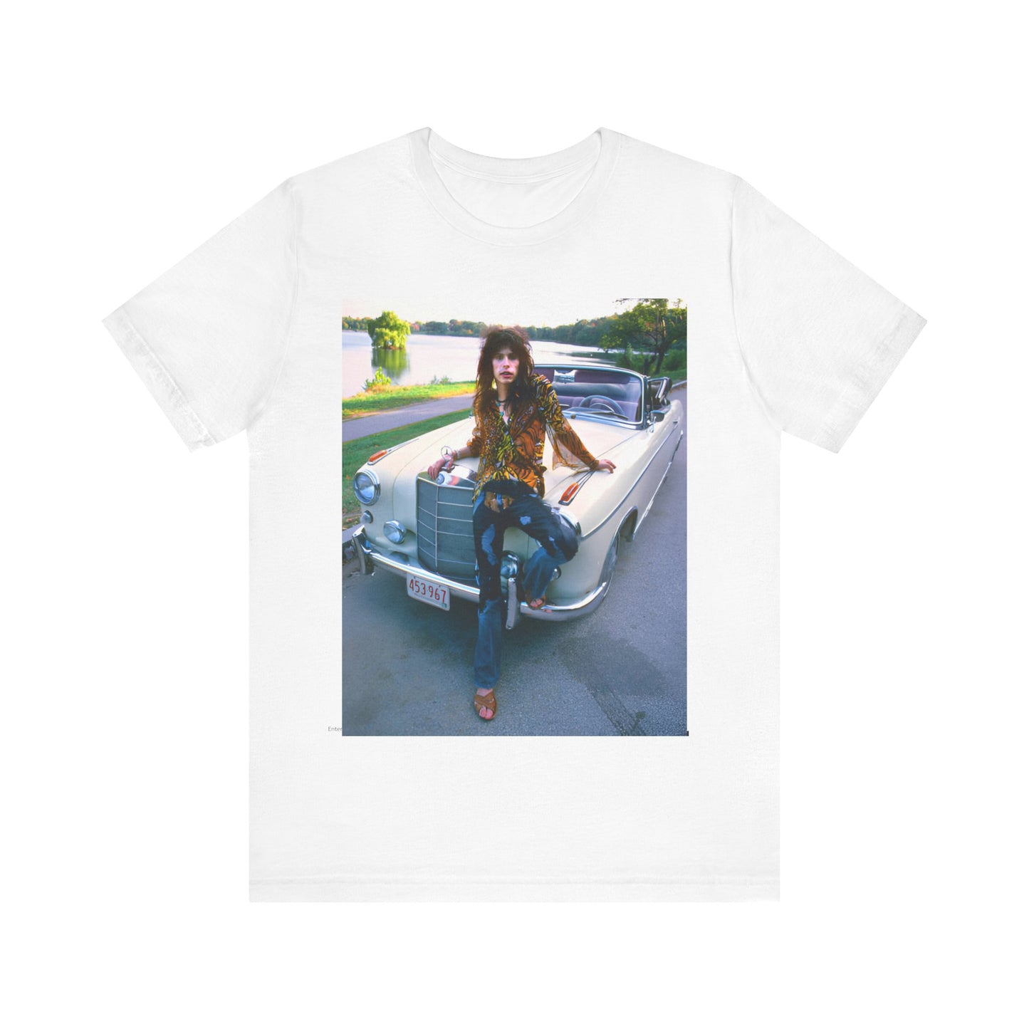 A black graphic t-shirt featuring a retro 70s photo of Aerosmith band members in a bohemian style, posing with a classic Mercedes car.