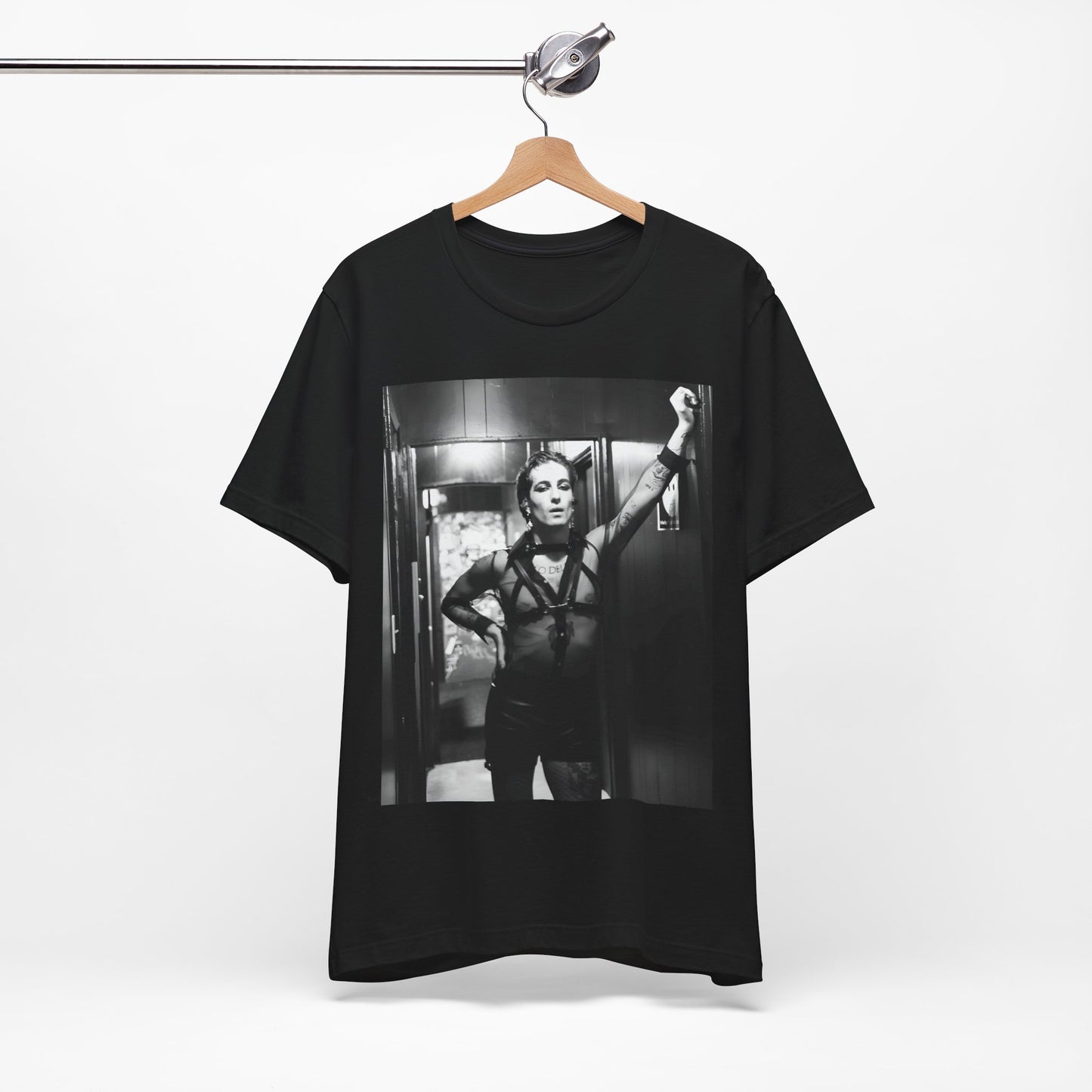 A black graphic t-shirt featuring a graphic of Maneskin emphasizing a rebel rock spirit.