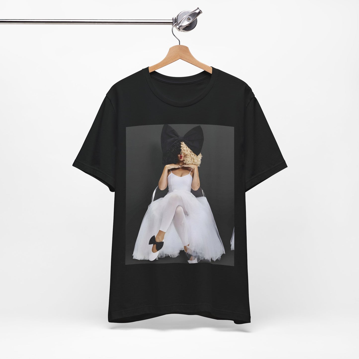 A black graphic t-shirt featuring a graphic of Sia's iconic wig style.