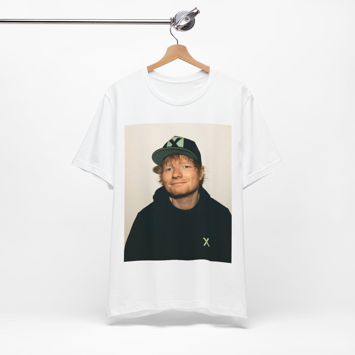 A black graphic t-shirt featuring a glamorous graphic of Ed Sheeran as a global tour icon.