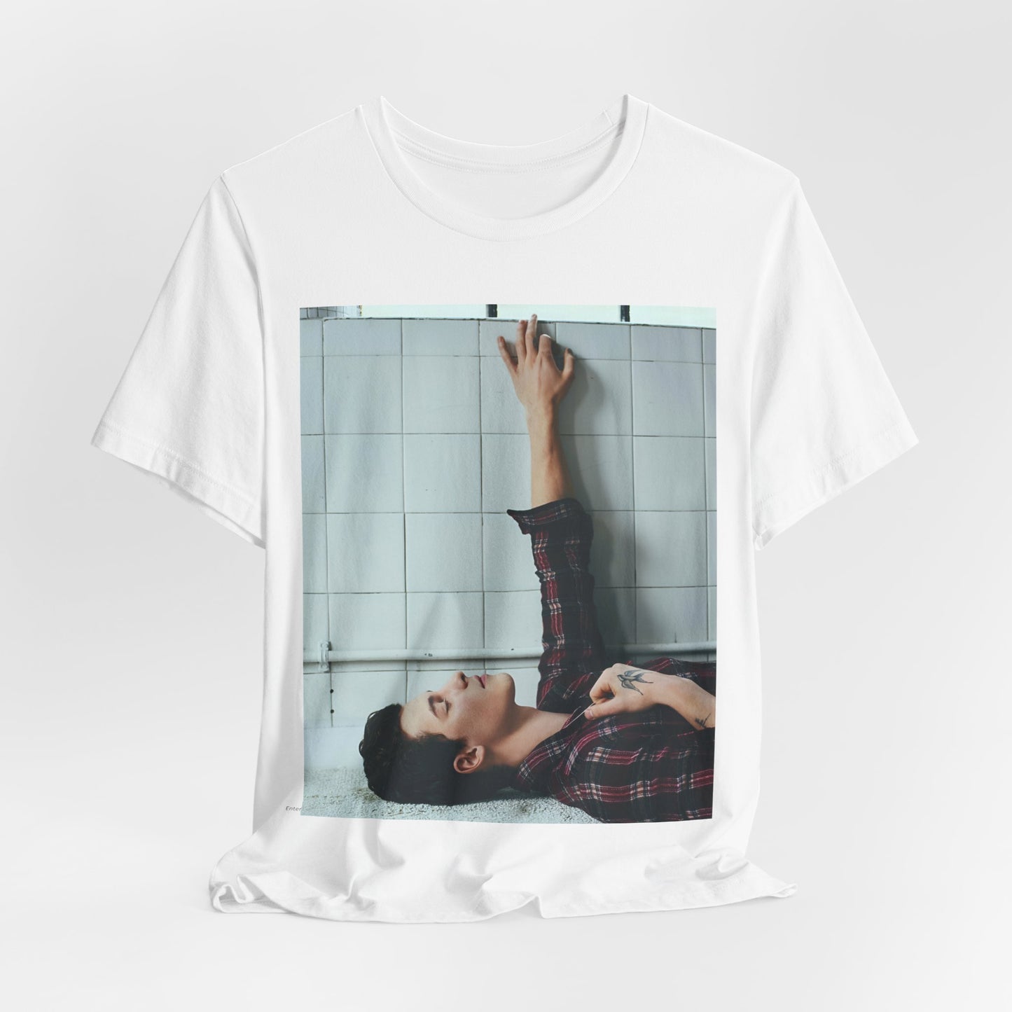 A black graphic t-shirt featuring a bold graphic of Shawn Mendes as a superstar.