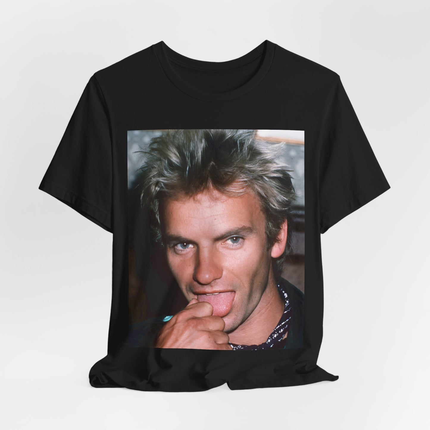 A black graphic t-shirt featuring an 80s new wave aesthetic graphic of Sting.