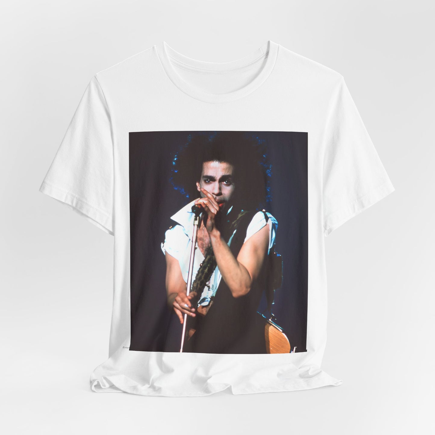 A black graphic t-shirt featuring a 90s live performance graphic of Prince.