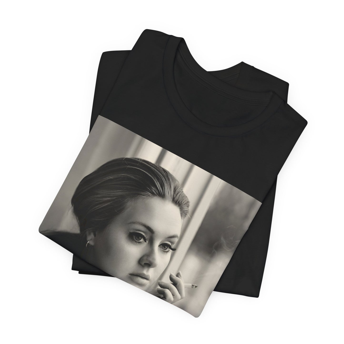 A black graphic t-shirt featuring a black and white photo of Adele, showing her with a serene or thoughtful expression.