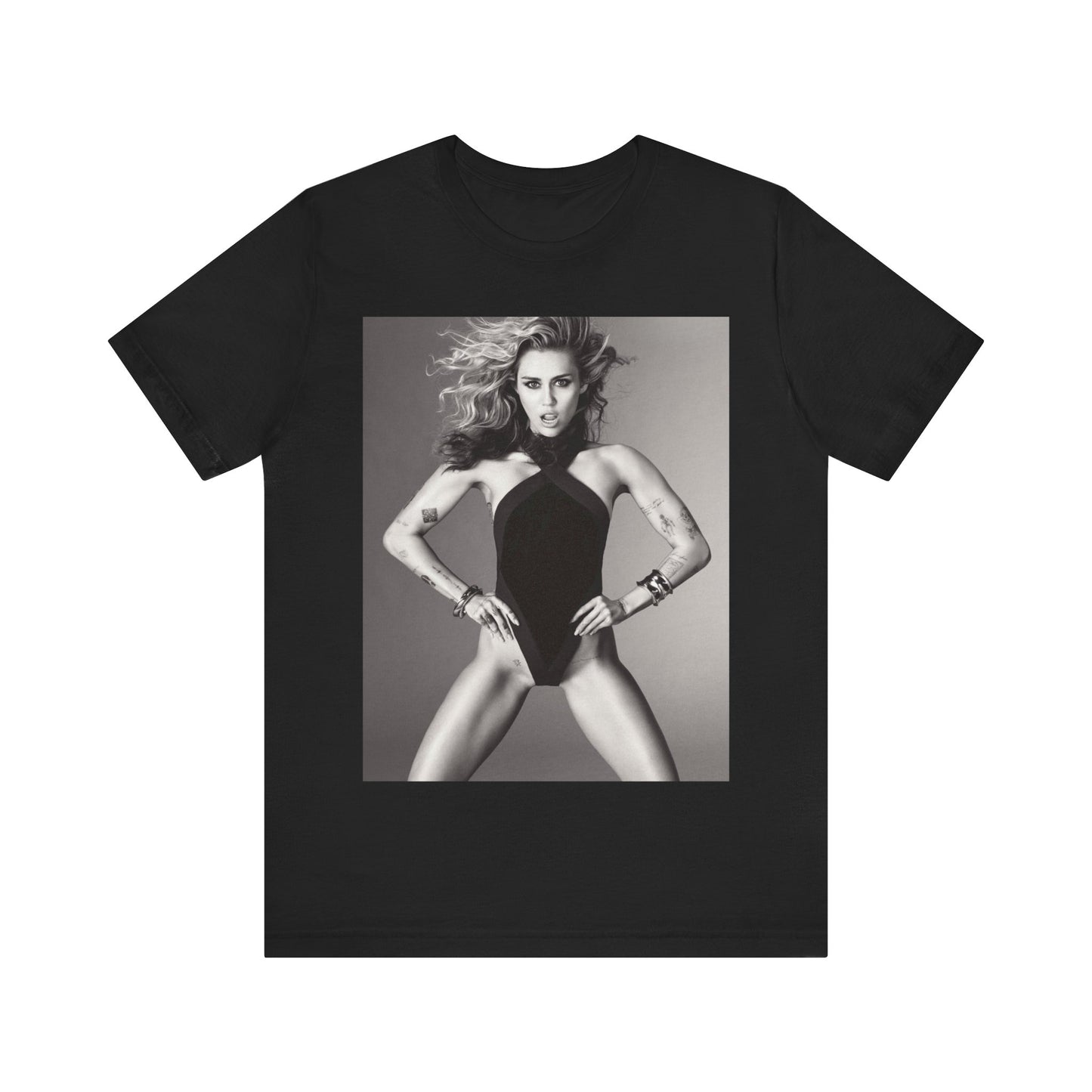 A black graphic t-shirt featuring a bold graphic of Miley Cyrus as a pop superstar.