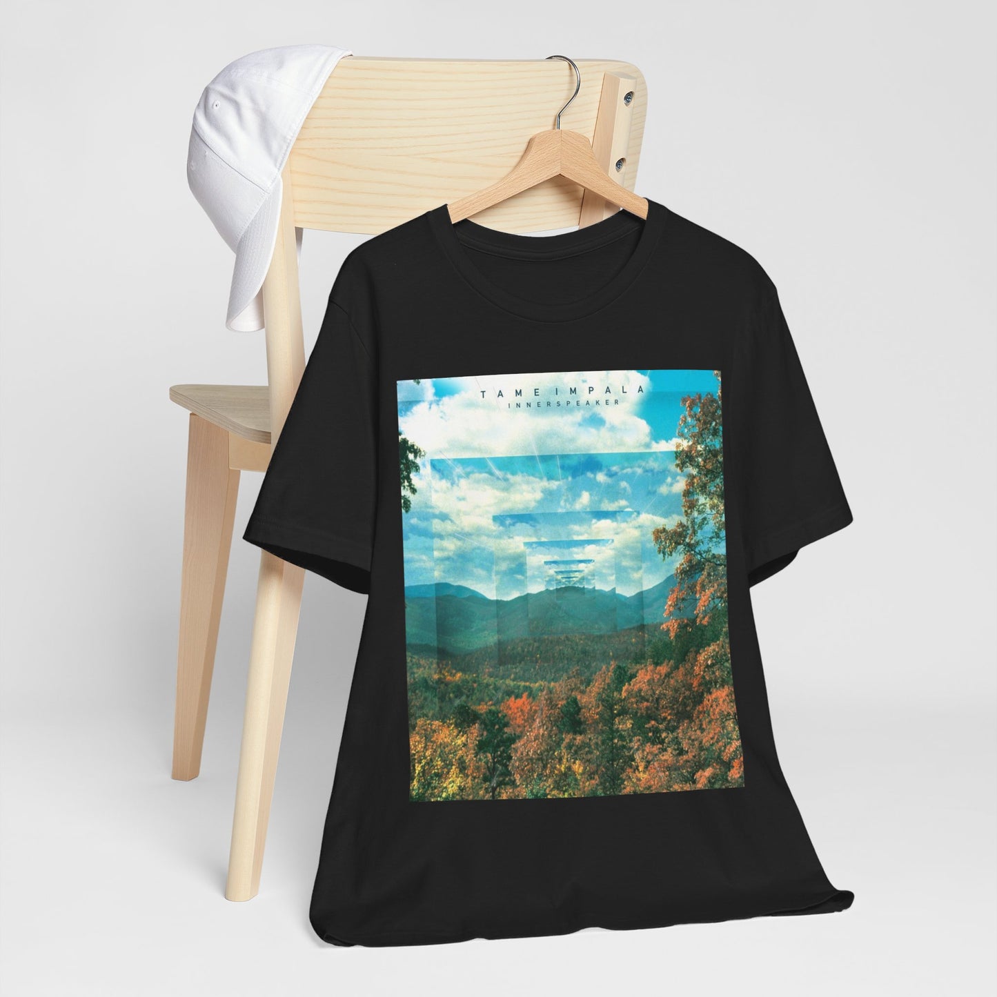 A black graphic t-shirt featuring a graphic related to Tame Impala's 'InnerSpeaker' album.