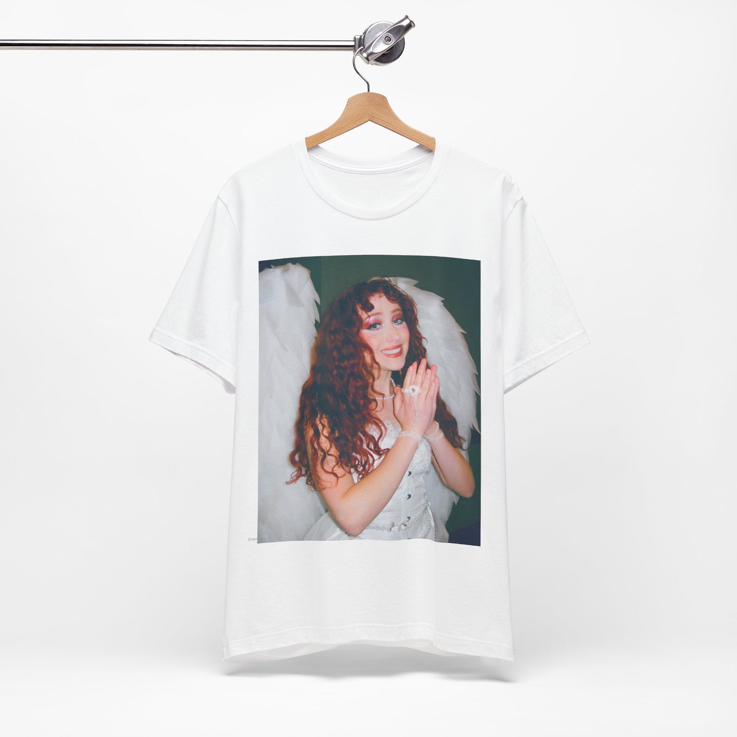 A black graphic t-shirt featuring a graphic of Chappell Roan, possibly with DIY or independent pop elements.