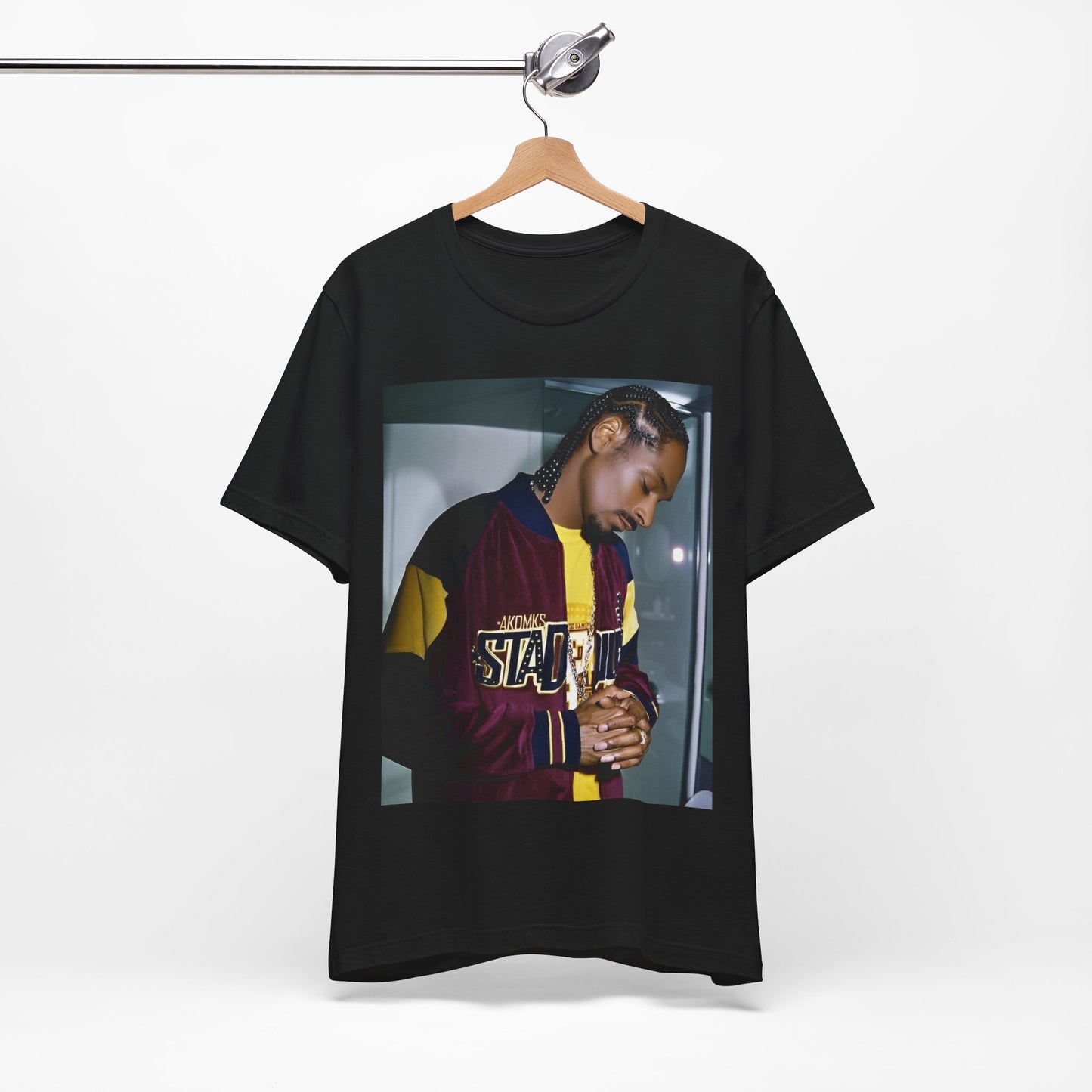 A black graphic t-shirt featuring a classic graphic of Snoop Dogg with a cool gaze.