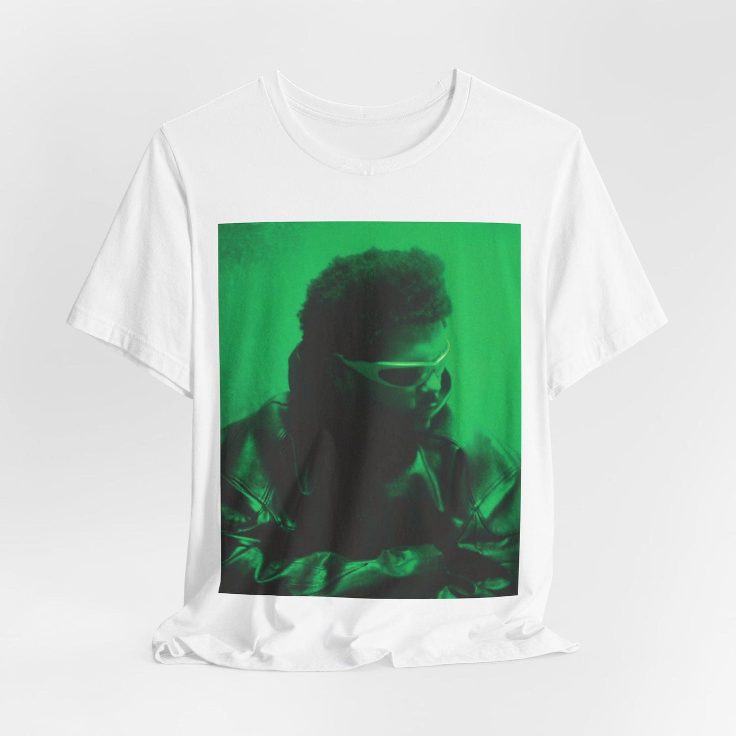 A black graphic t-shirt featuring a vintage graphic related to The Weeknd's 'Kiss Land' era.