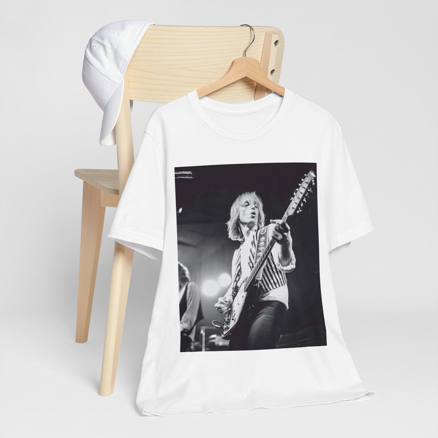 A black graphic t-shirt featuring a graphic of Tom Petty as a Rock & Roll Hall of Fame icon.