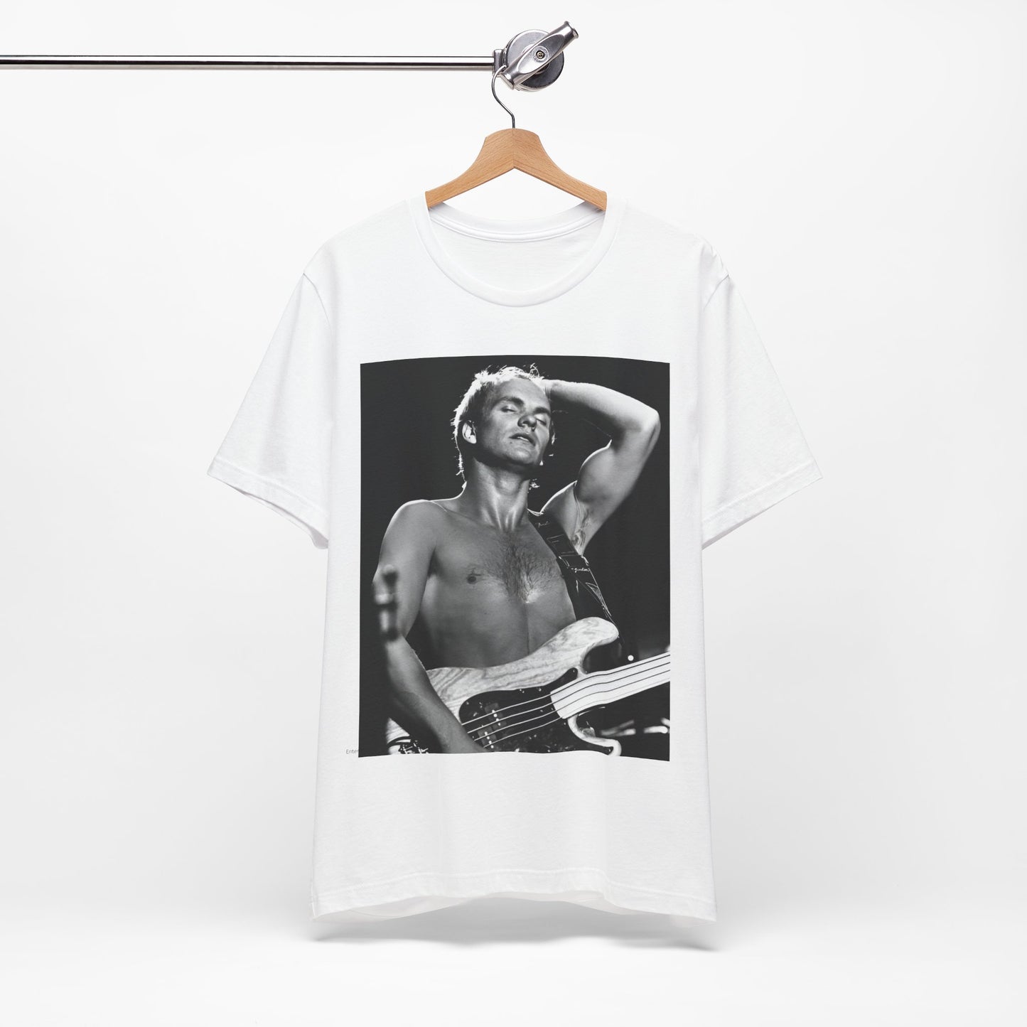 A black graphic t-shirt featuring a graphic or photo of Sting performing live on stage in 1983.