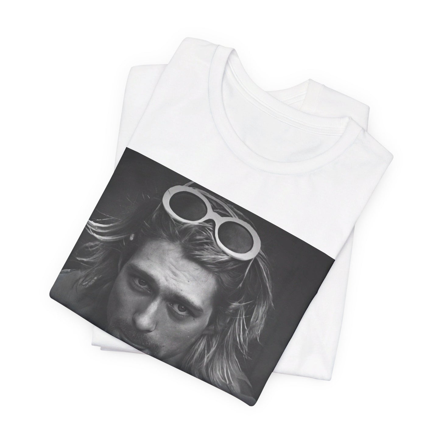 A black graphic t-shirt featuring a photo of Kurt Cobain from Nirvana wearing sunglasses.
