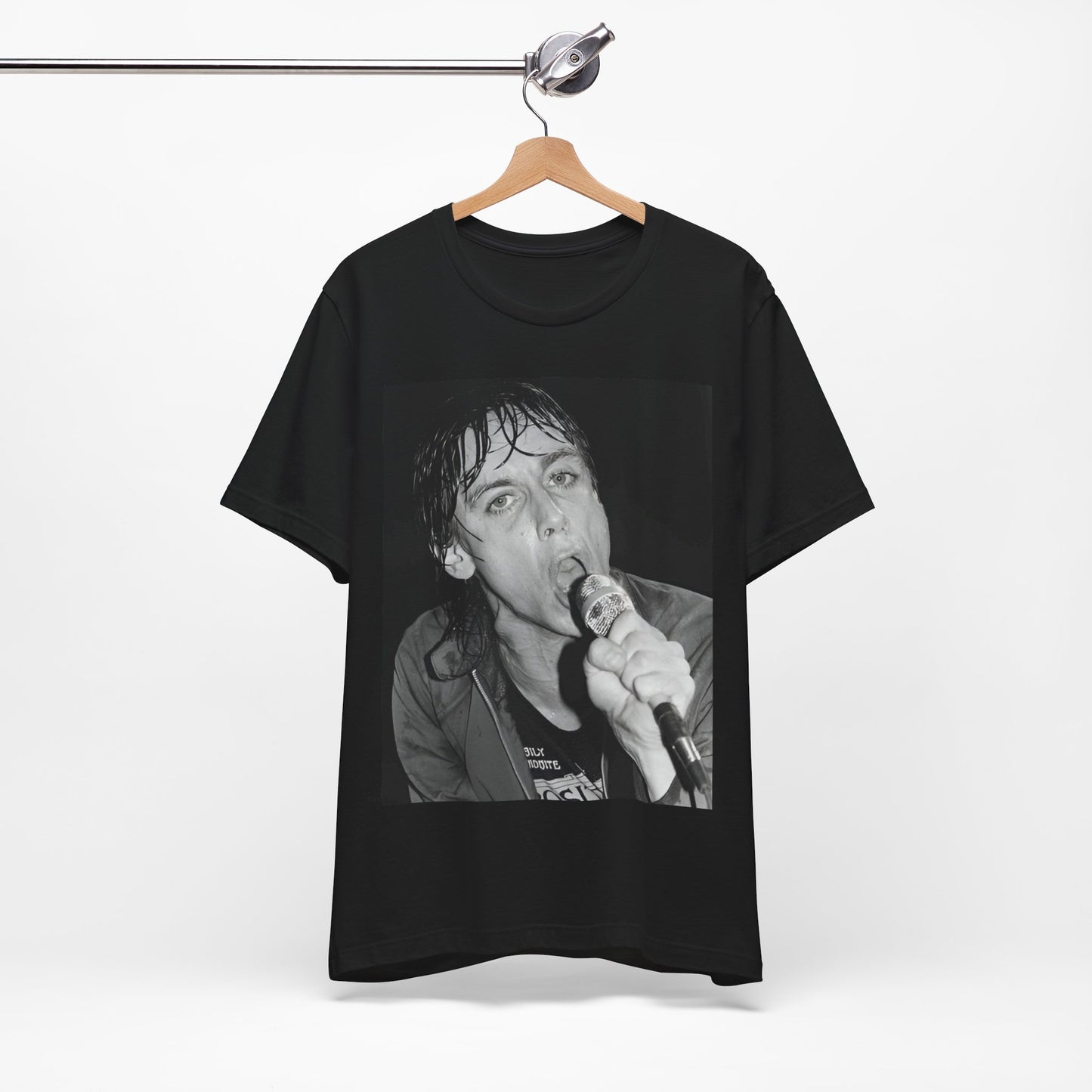 A black graphic t-shirt featuring a 70s graphic or photo of Iggy Pop performing in a wild concert.