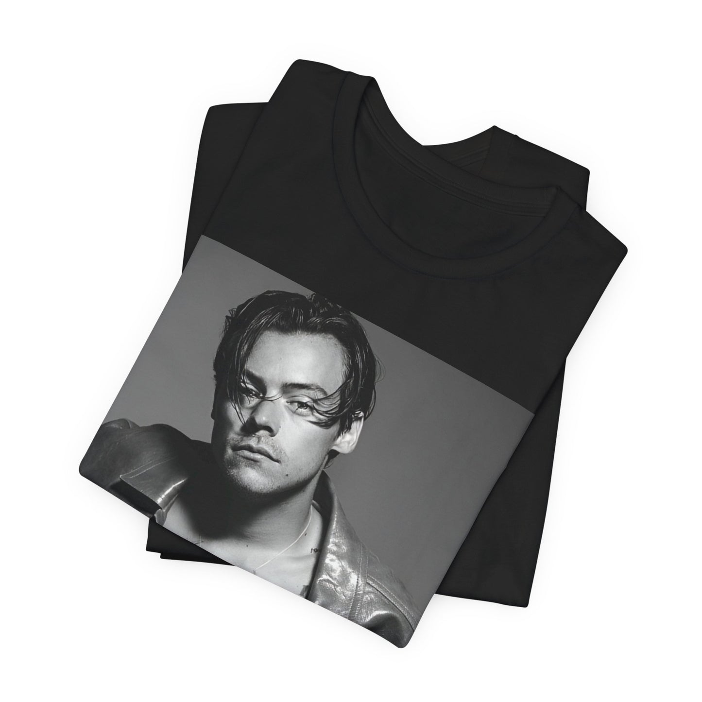 A black graphic t-shirt featuring a black and white portrait photo of Harry Styles.
