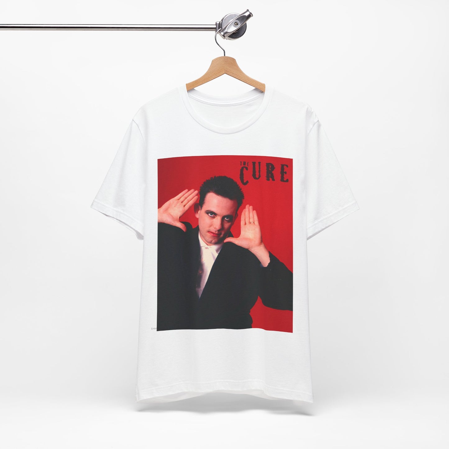 A black graphic t-shirt featuring a graphic of Robert Smith from The Cure in his authentic style.