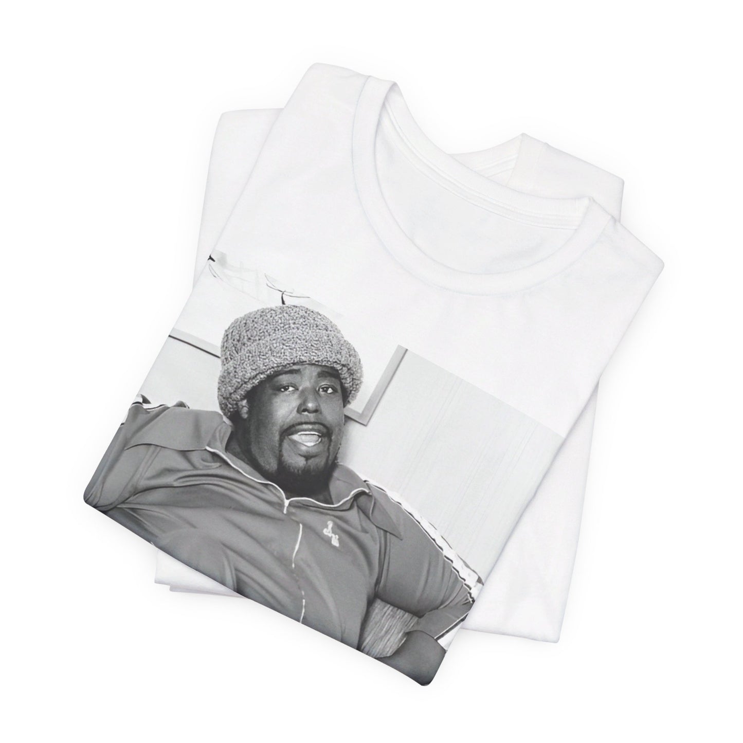 A black graphic t-shirt featuring a 70s-style portrait photo of Barry White in a lounge setting.