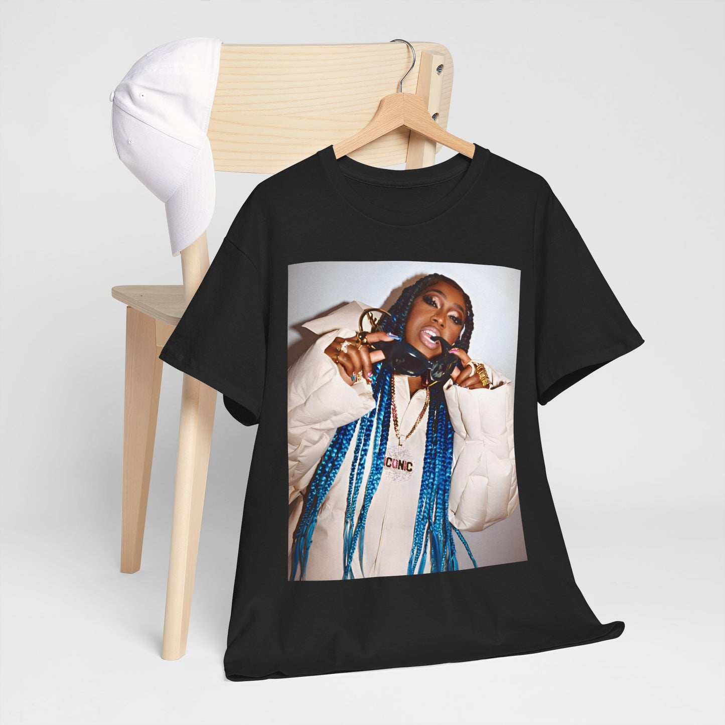 A black graphic t-shirt featuring a retro graphic related to Missy Elliott's 'Supa Dupa Fly' album era.