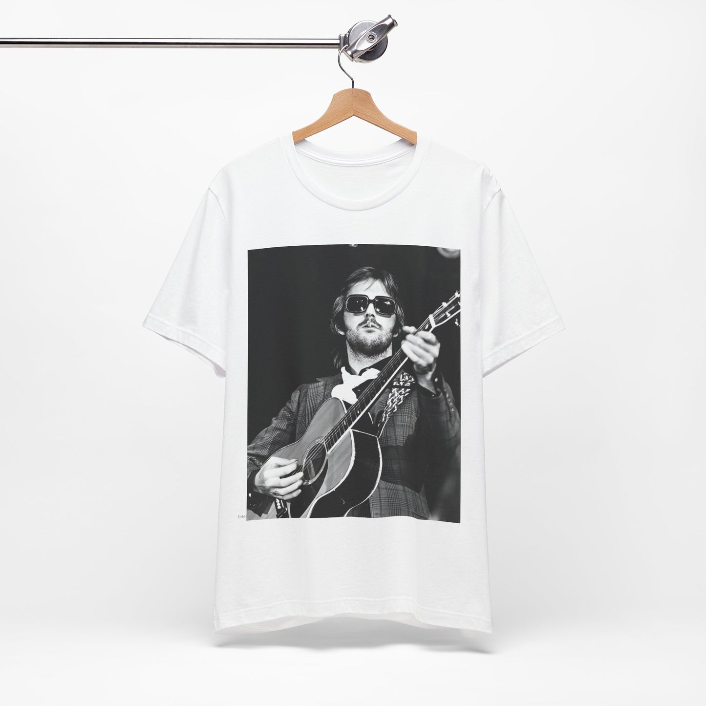 A black graphic t-shirt featuring a graphic of Eric Clapton with a chill blues rock vibe.