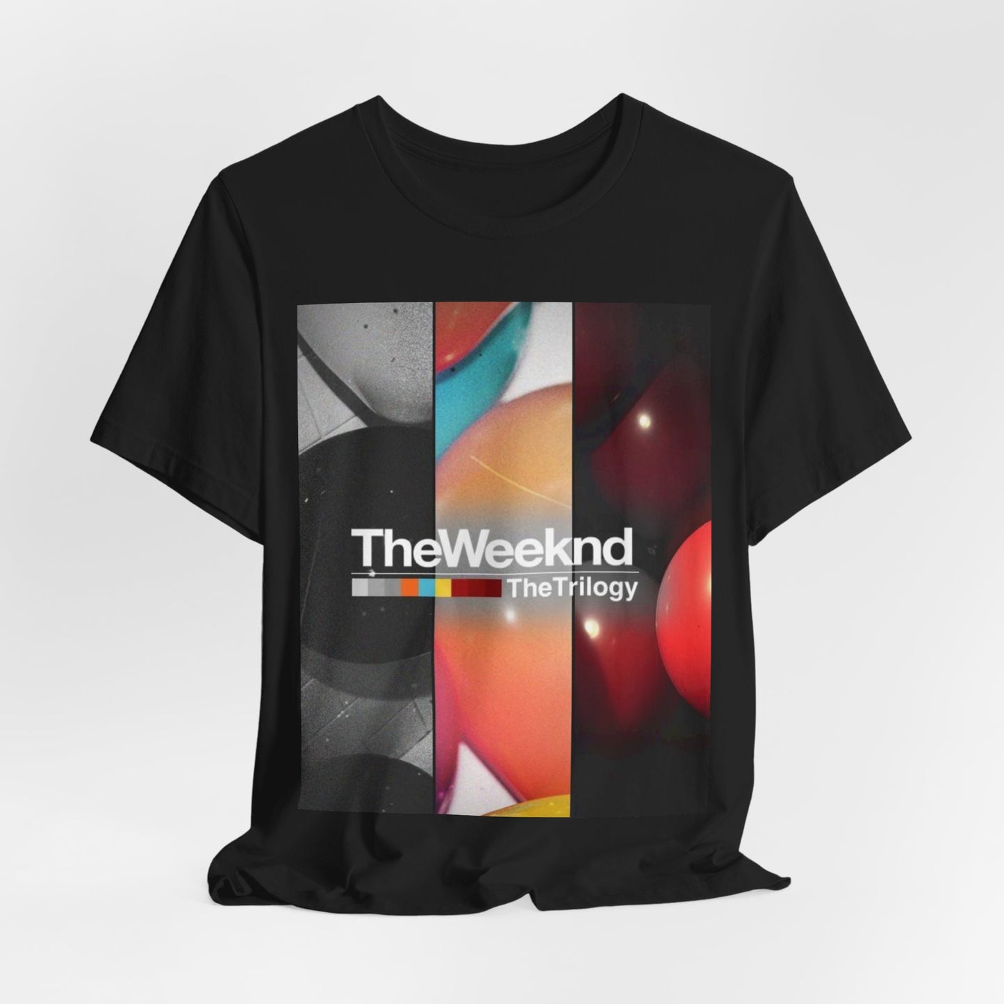 A black graphic t-shirt featuring a graphic related to The Weeknd's 'The Trilogy' album.
