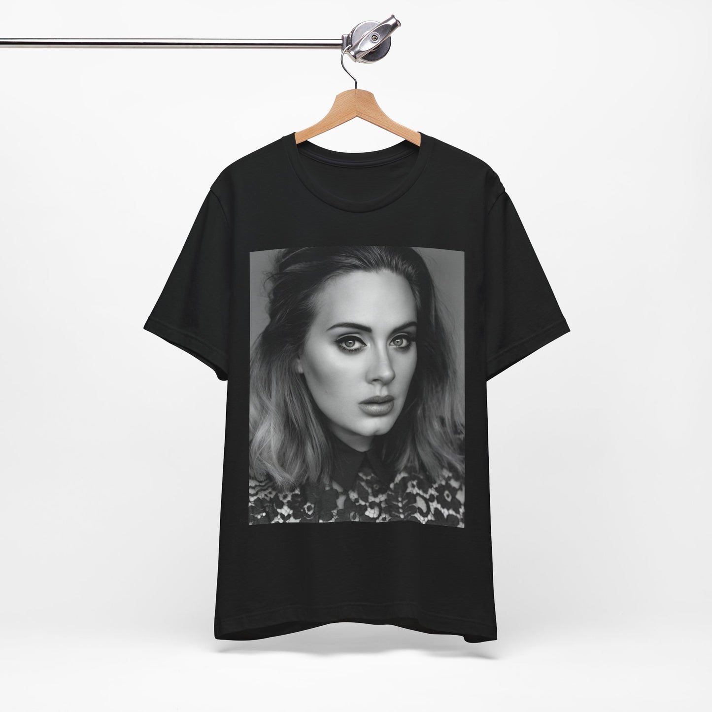 A black graphic t-shirt featuring a classic black and white, monochrome portrait of Adele, showing her with a serene or thoughtful expression.