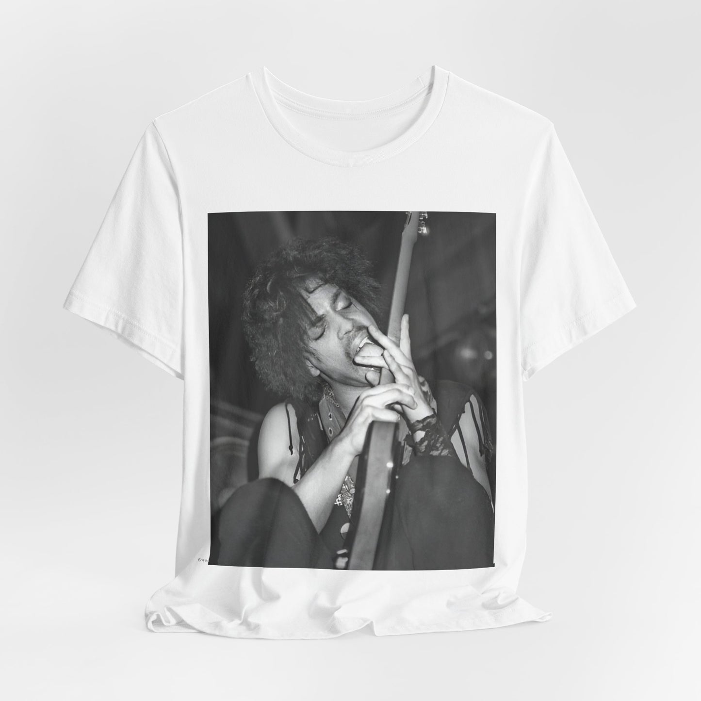 A black graphic t-shirt featuring a graphic or photo of Prince performing wildly on stage.