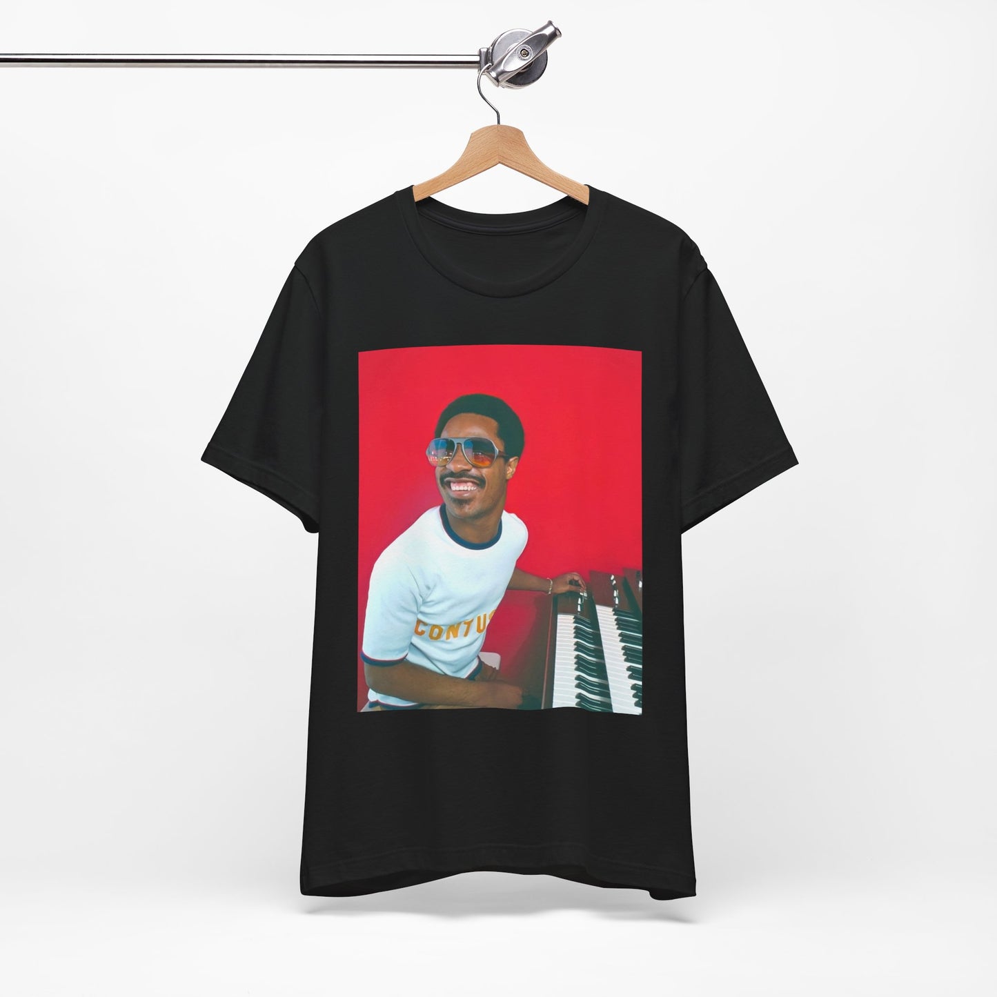 A black graphic t-shirt featuring a graphic of Stevie Wonder with a piano.