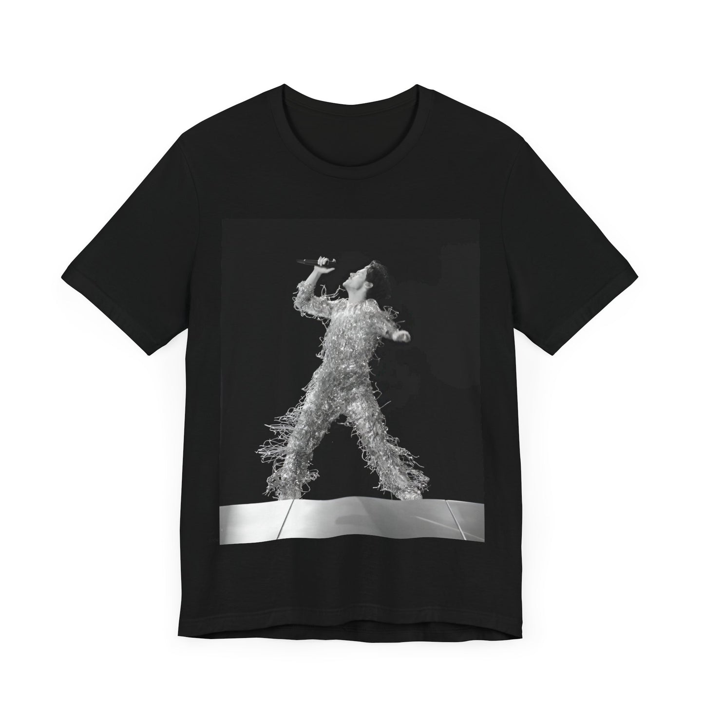 A black graphic t-shirt featuring a boxy pop aesthetic graphic of Harry Styles.