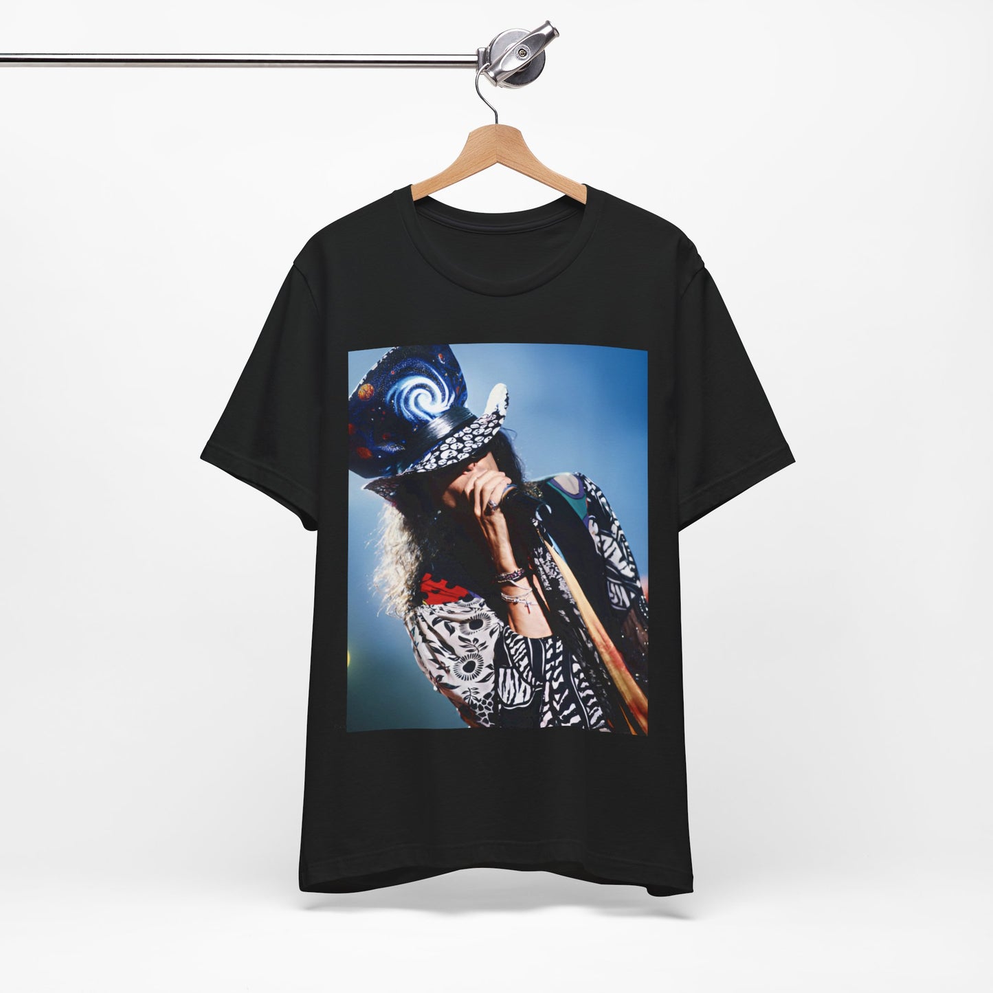 A black graphic t-shirt featuring a vintage 90s photo or illustration of Aerosmith performing live on stage, with band members in dynamic poses.