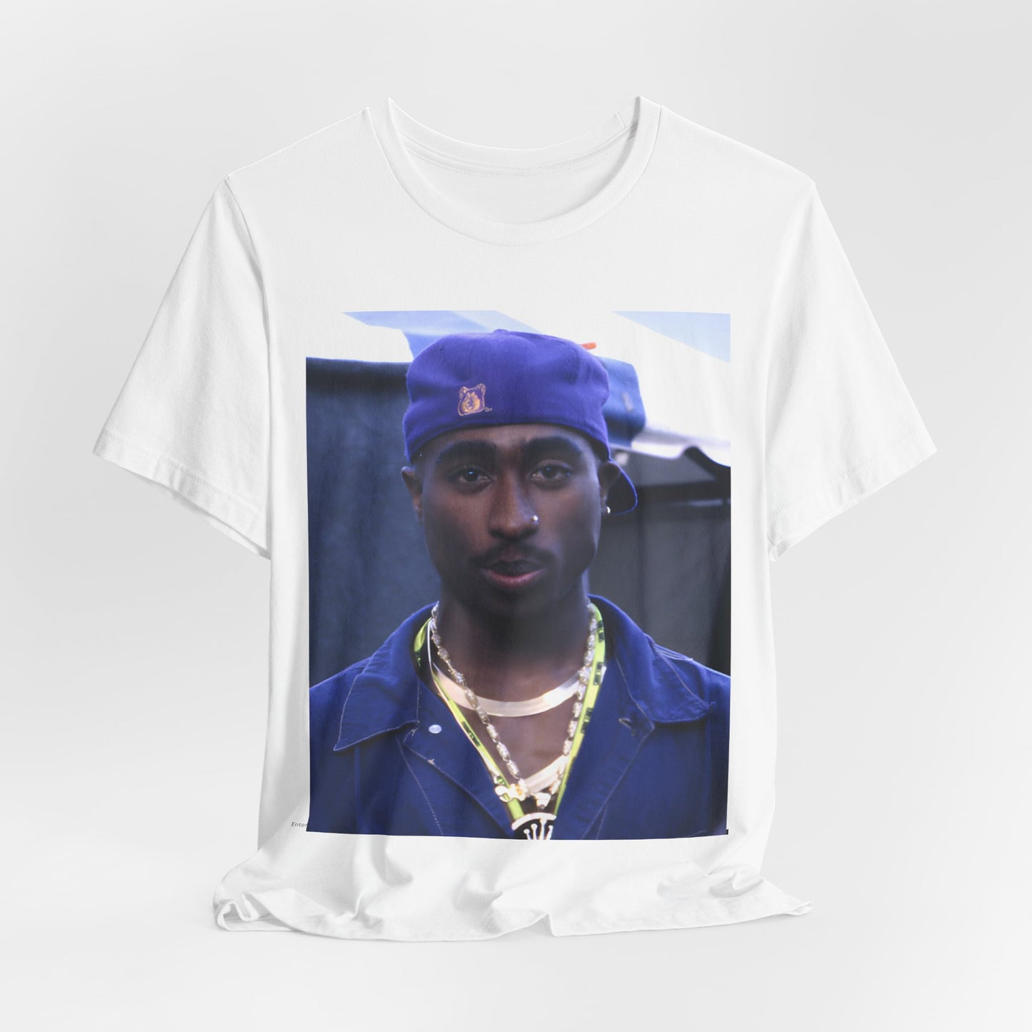 A black graphic t-shirt featuring a graphic related to Tupac's 'California Love' song or era.