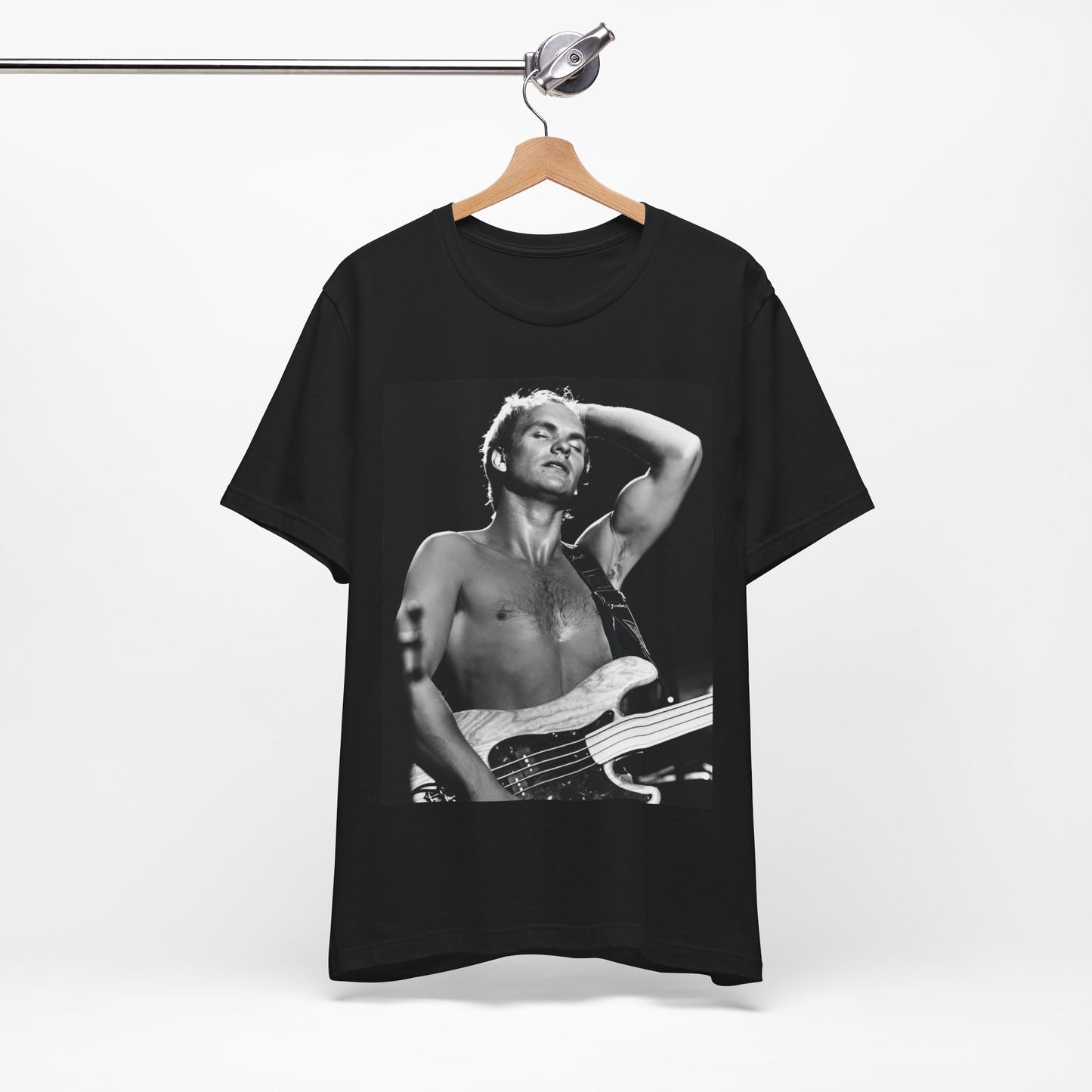 A black graphic t-shirt featuring a graphic or photo of Sting performing live on stage in 1983.