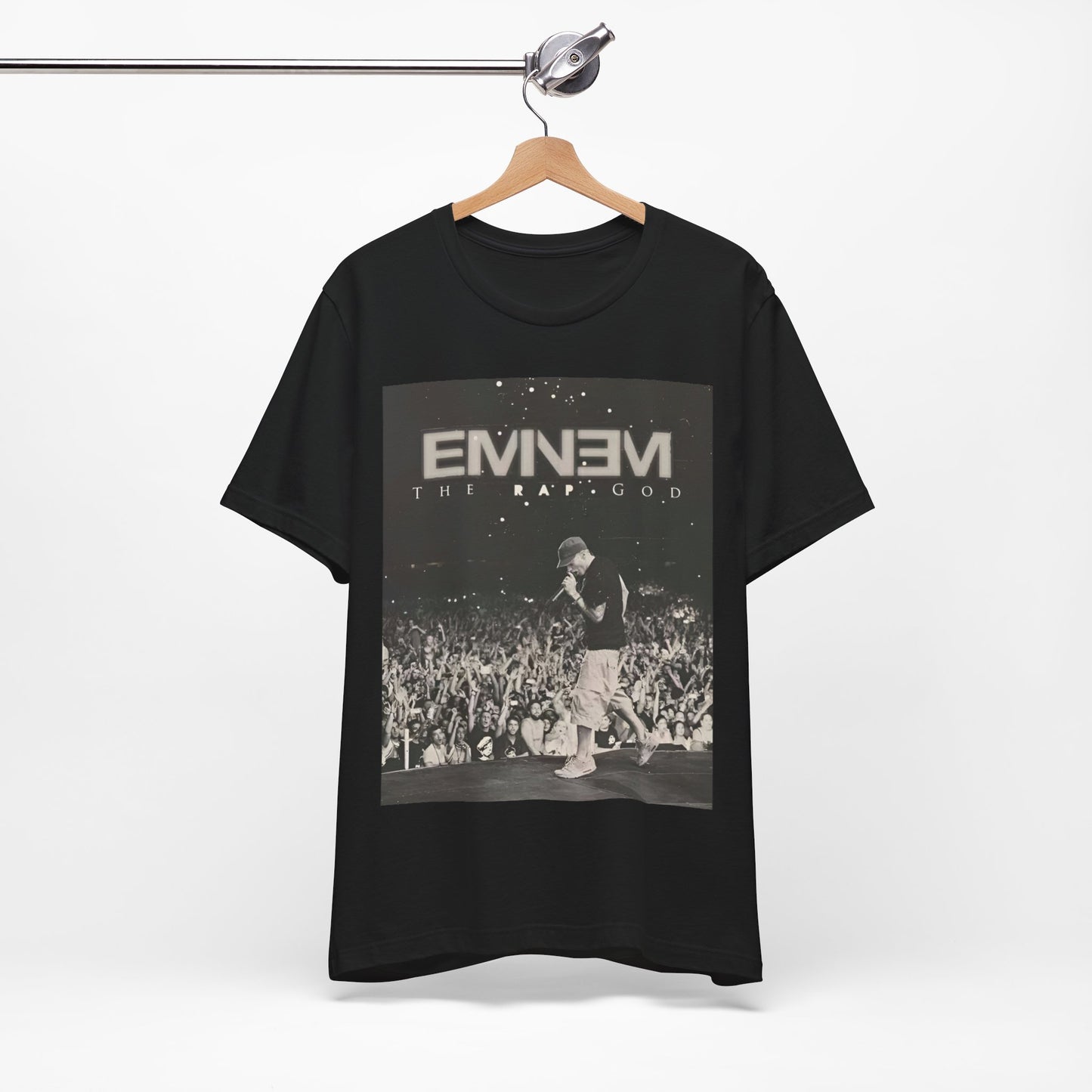 A black graphic t-shirt featuring a graphic or photo of Eminem performing live on tour.