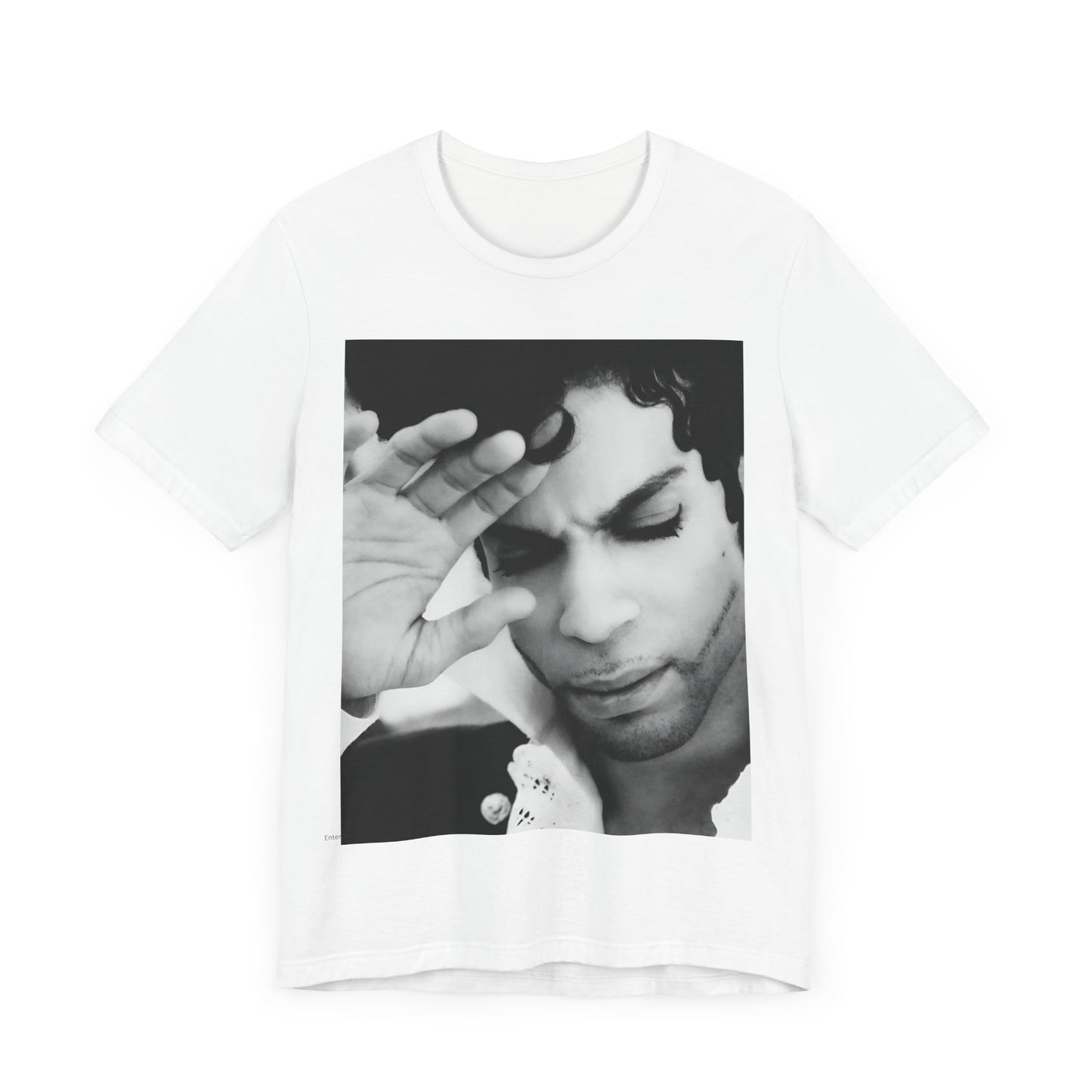 A black graphic t-shirt featuring a black and white graphic or photo portrait of Prince.