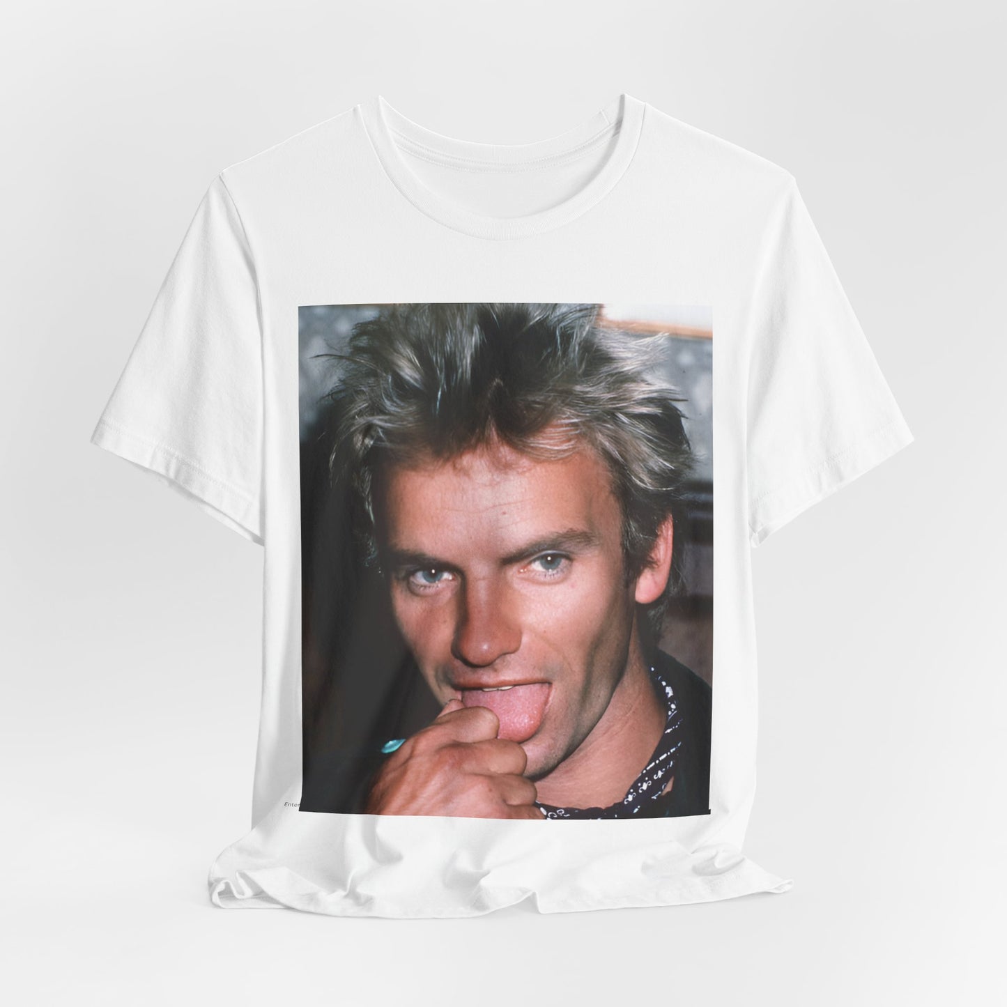 A black graphic t-shirt featuring an 80s new wave aesthetic graphic of Sting.