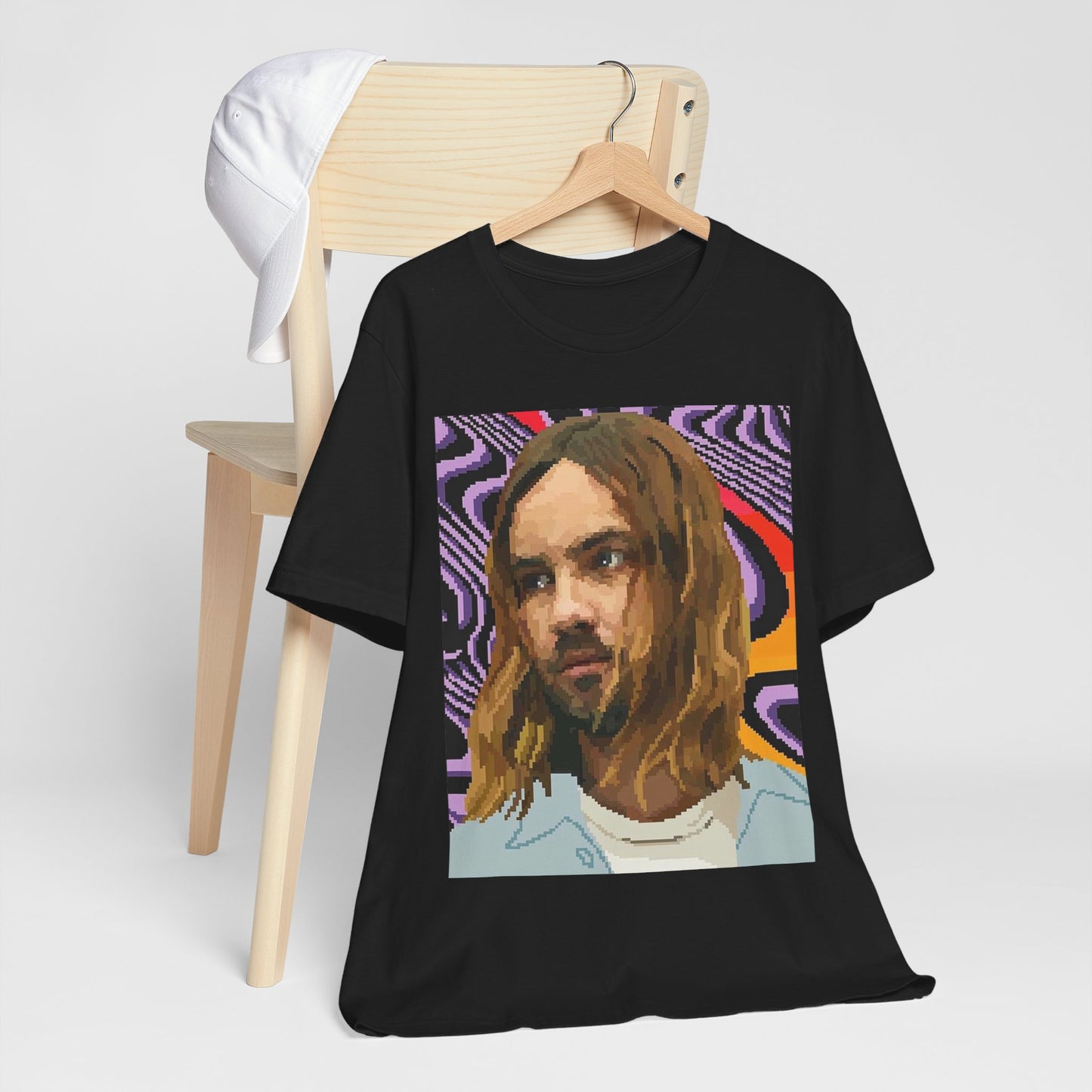 A black graphic t-shirt featuring a vintage graphic of Tame Impala with mind-bending visuals.